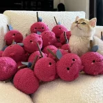 Cat playing with Clawcove Onion Silvervine Cat Toy, chewing and enjoying its durable plush design.