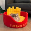 A happy cat curled up inside the cozy French Fries Cat Bed, enjoying a comfortable nap.