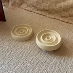 Top view of the ceramic slow feeder cat bowl, featuring circular ridges to slow down eating.