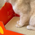 Side view of the cat scratcher bed with a 3D cheesy fries shape.