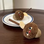 Close-up view of the silvervine stick and fresh catnip ball on the Matatabi cat chew toy.