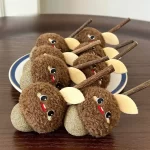 Close-up view of the silvervine stick and fresh catnip ball on the Matatabi cat chew toy.