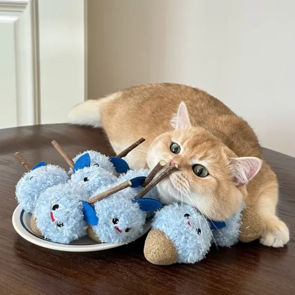 A happy cat playing with the Matatabi catnip chew toy, rolling and kicking it.