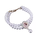 Close-up of the sparkling gemstone pendant on the pet necklace.